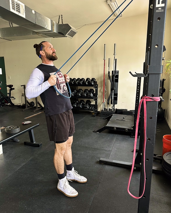 Bryan Crossley, Washington DC Personal Trainer, does banded exercises in DC Strength and Nutrition gym