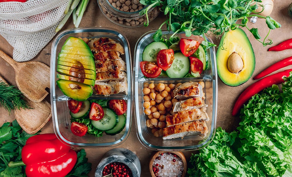 Meal prep containers with avocado, sliced chicken breast, garbanzo beans and cucumber tomato salad, Integrative Nutritionist in Washington DC, Shaw District