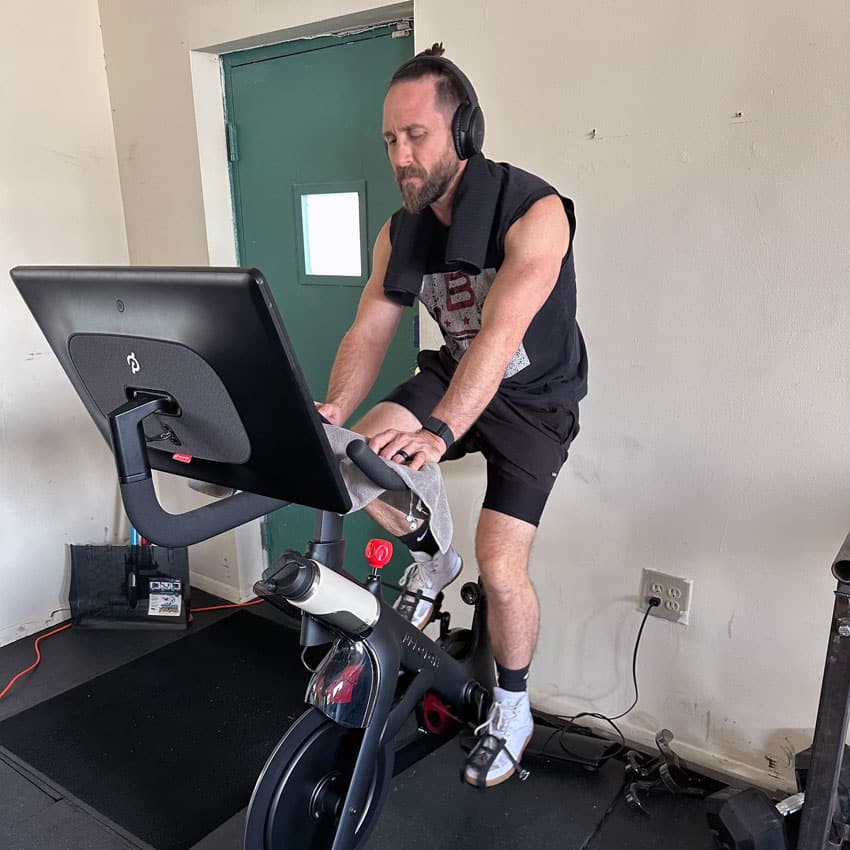 Bryan Crossley, personal trainer, does a cardio workout on a stationary bike