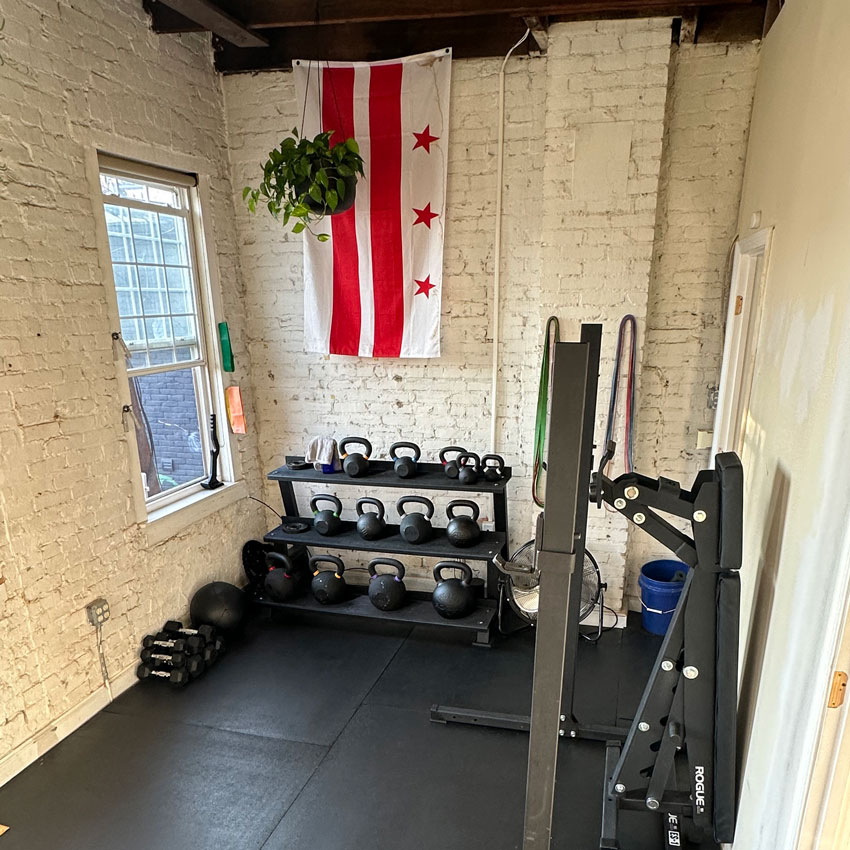 DC Strength and Nutrition Boutique Strength Training Gym weights and interior with Washington DC flag